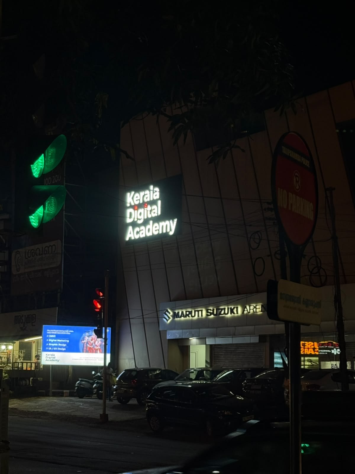 Kerala Digital Academy signage lit up at night, Chiravakk Signal, Taliparamba