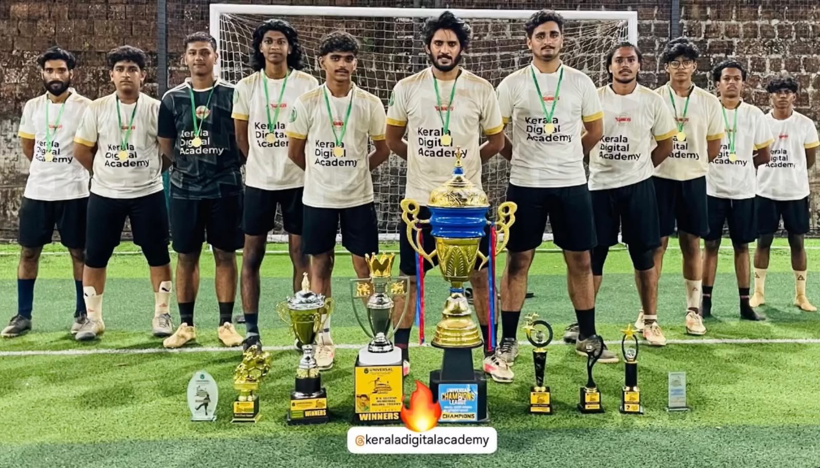 Kerala Digital Academy football team with championship trophies