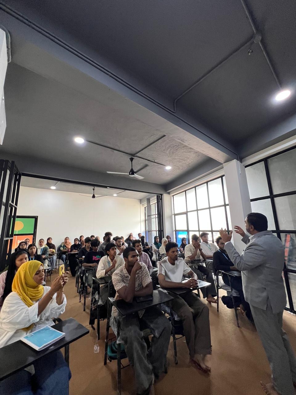 Trainer addressing students during a guest lecture